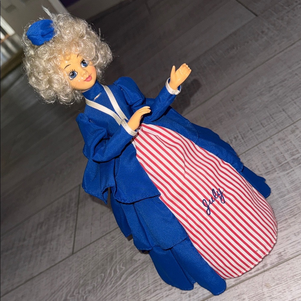 Brinn’s Collectible Musical Rotating Calendar Doll July
